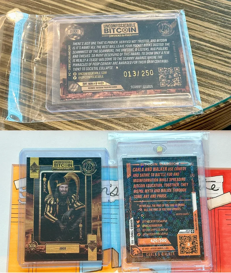 Numbered Bitcoin Trading Cards in sleeves, including an Unconfiscatable Bitcoin card numbered 013/250 and a Carla and Walker card